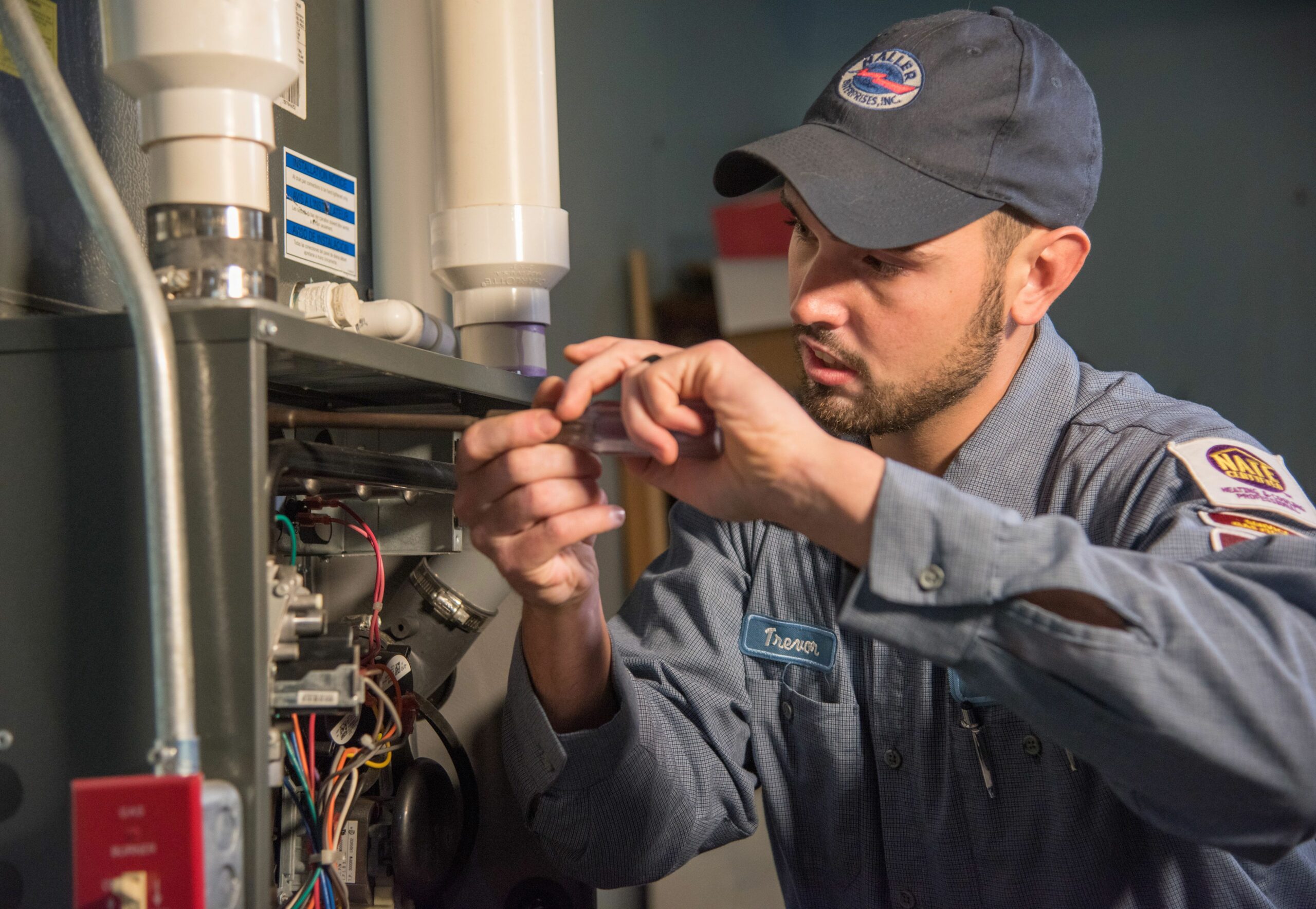 Haller technician working on a furnace close up