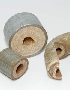 Pieces of pipe with calcium build up inside
