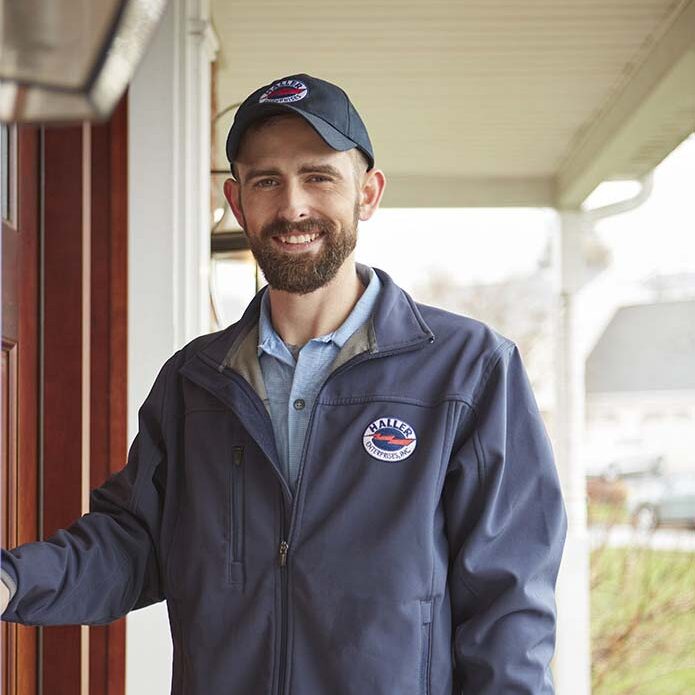 Haller Enterprise technician entering home