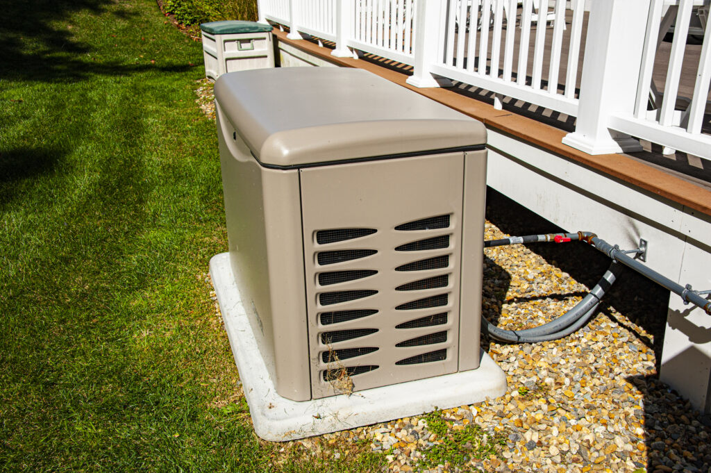 Residential standby generator on concrete pad.