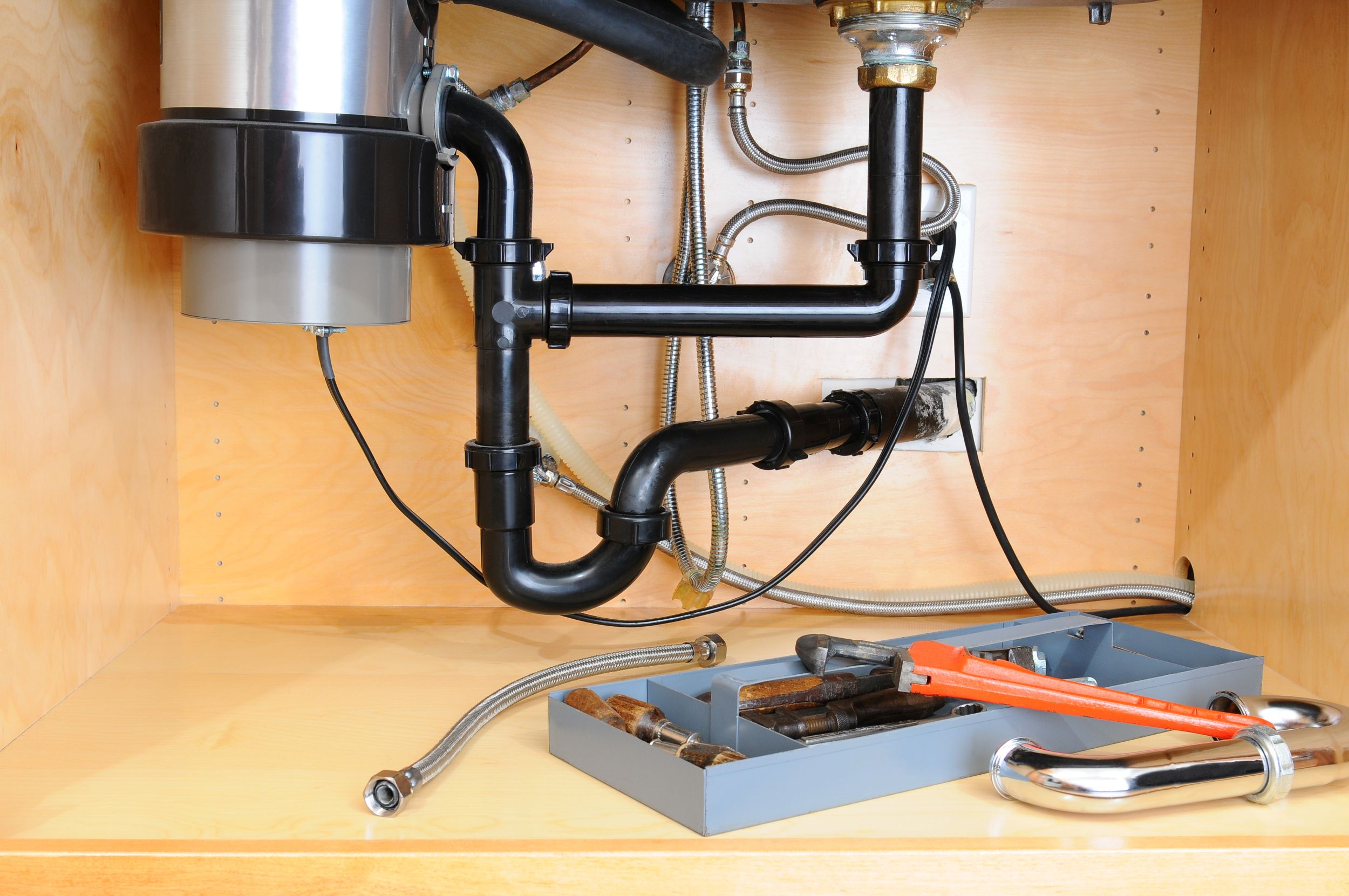 Who Should Install Your Garbage Disposal: a Plumber or an Electrician?