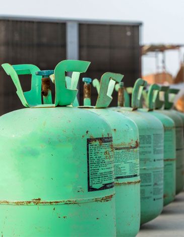 Barrels of R-22 refrigerant in a line