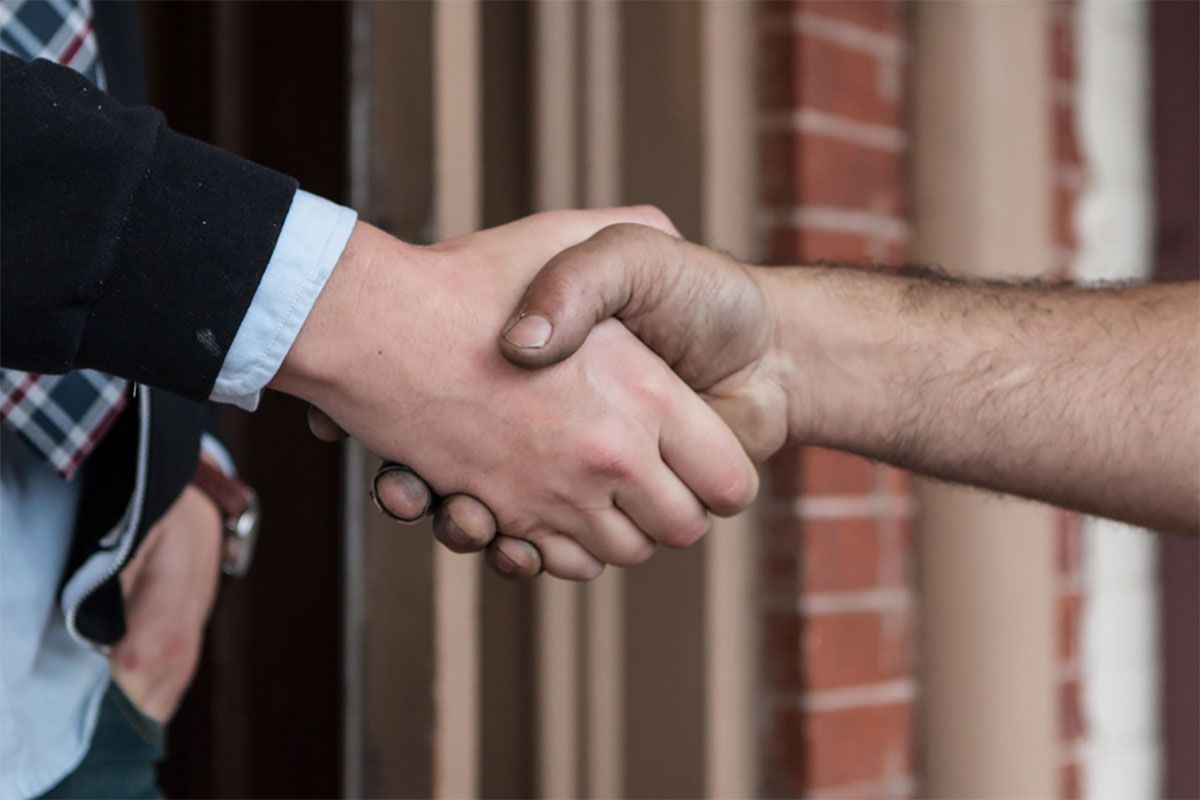 Handshake of business owner and Haller tech