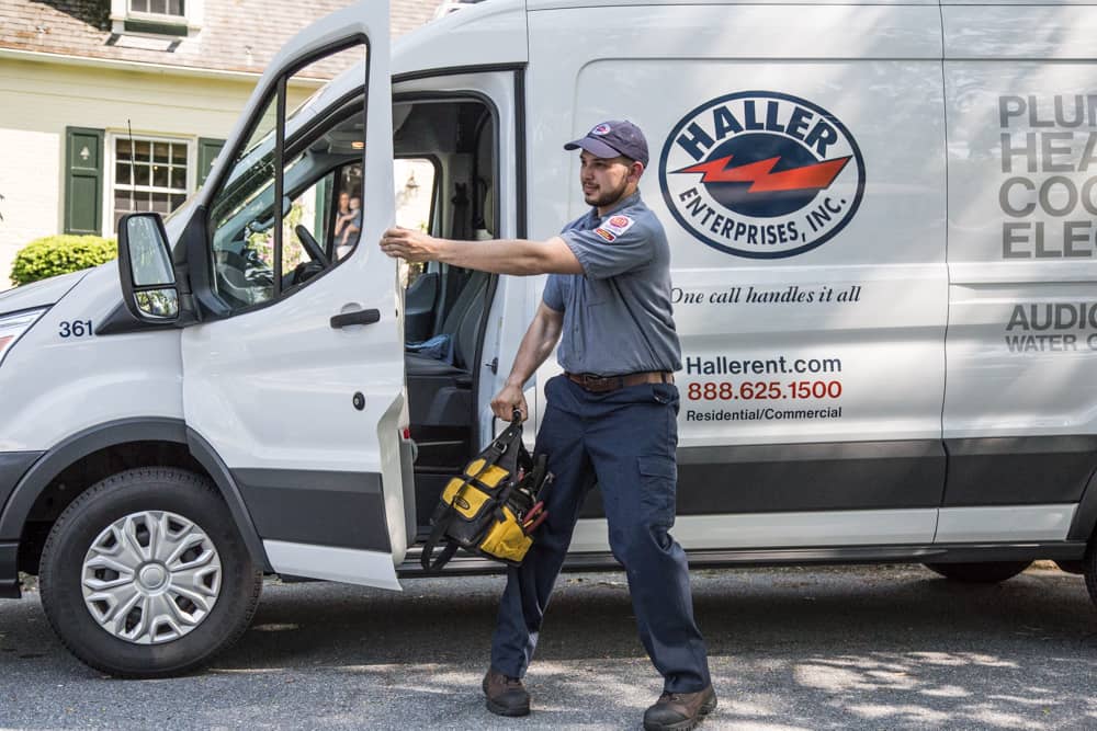 Haller technician getting out of service van