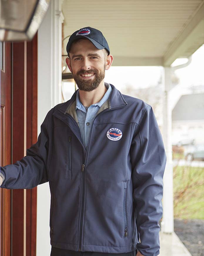 Haller HVAC technician at a customer's door